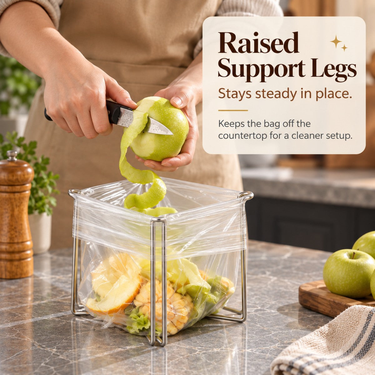 Raised support legs keeping a trash bag holder stable on kitchen counter