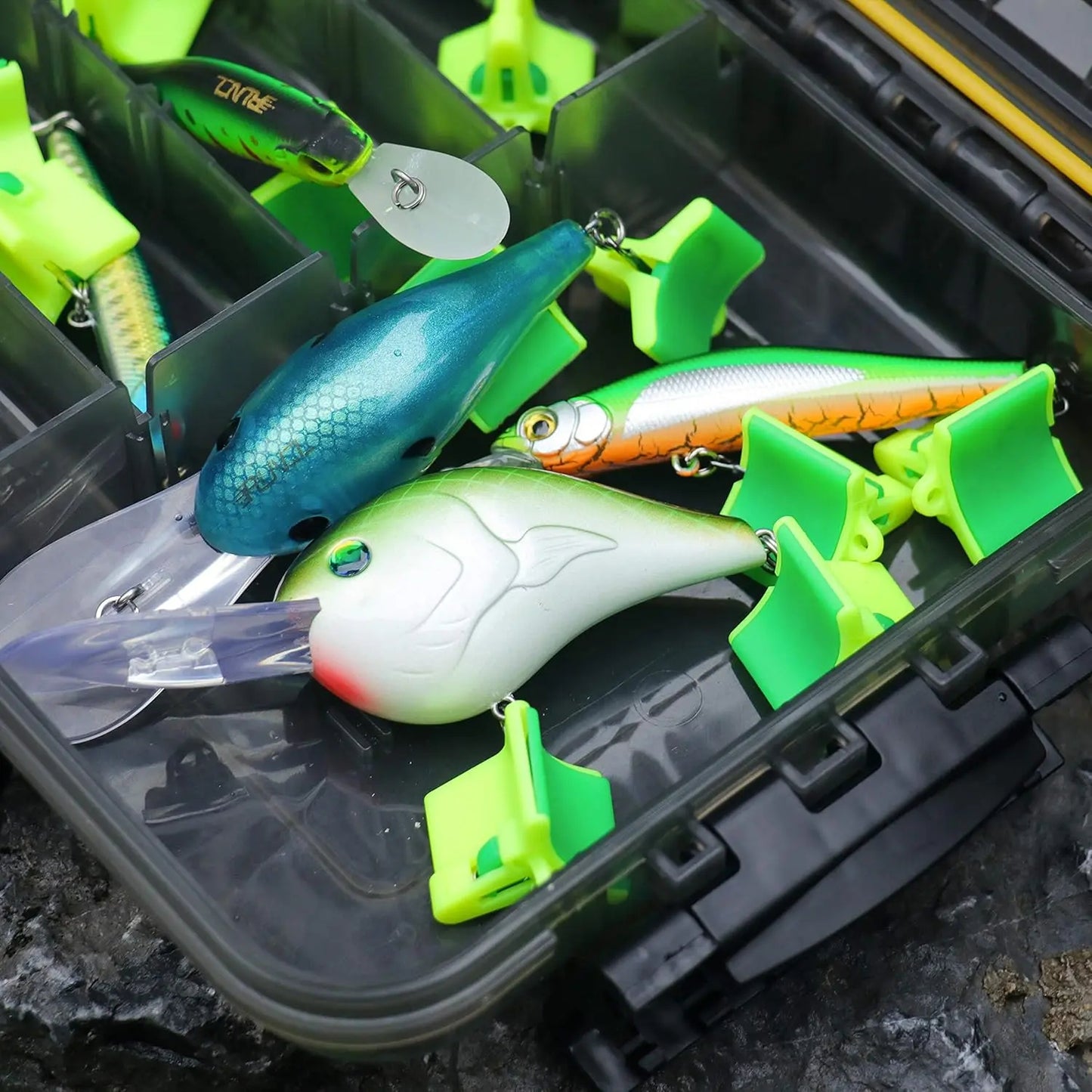 Fishing lures stored with treble hook covers in tackle box